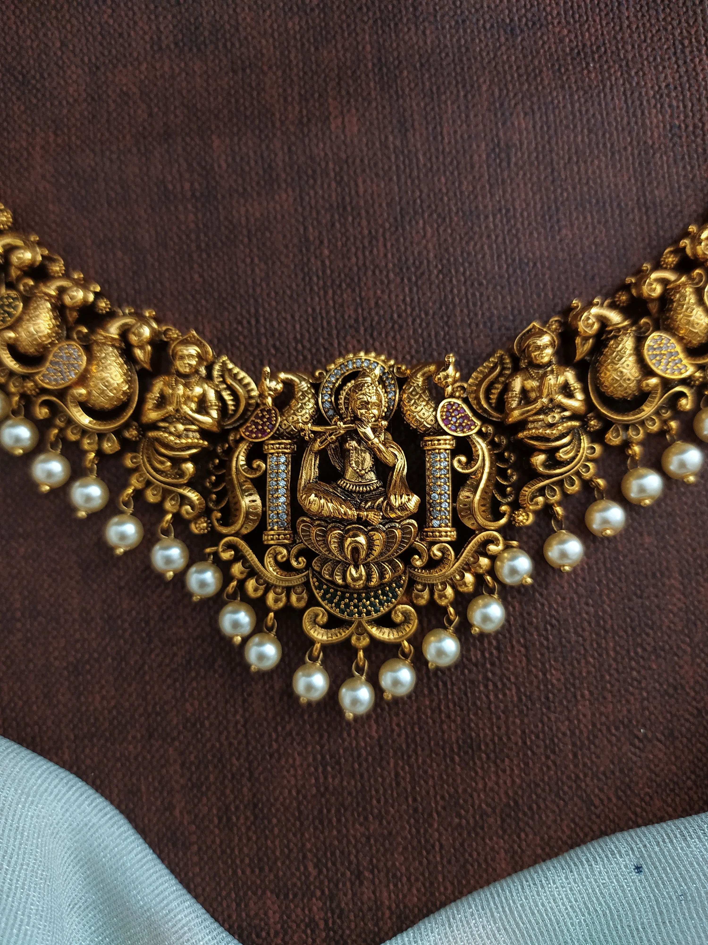 Antique Krishna Necklace Set with Nagas Work, Zircon Stones, and Pearl Drops"