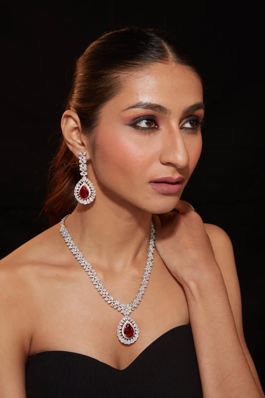 Rhodium Plated Zircon Studded With Red Synthetic Stone Pendant Necklace & Drop Earrings Set